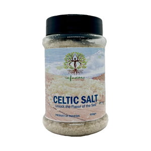 Celtic Salt, A jar of Celtic salt labeled 'Unlock the Flavor of the Salt' with a logo featuring a tree. The jar contains white crystalline salt and has a black lid, indicating it's a product from Pakistan. The jar holds 500 grams.